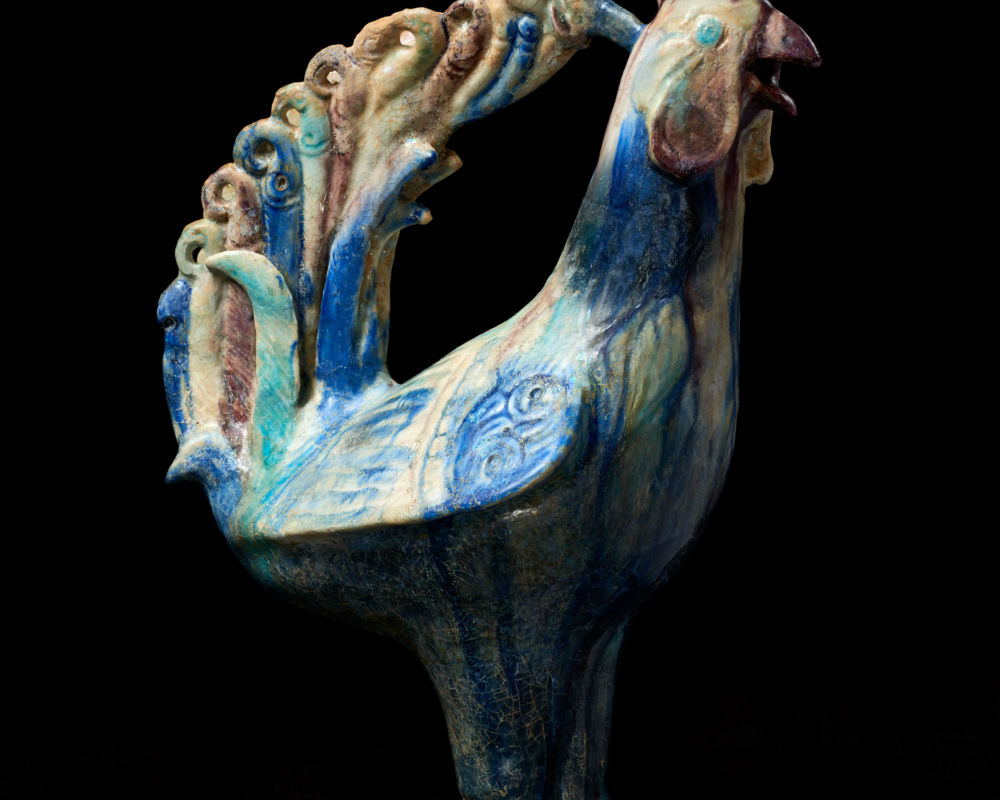 Fritware Cockerel-Parrot from al-Rafiqa
Al-Rafiqa - c.1150 CE. Fritware, splashed in blue, turquoise, and manganese under a transparent glaze. Dimensions H 38.5 cm. The David Collection, Copenhagen